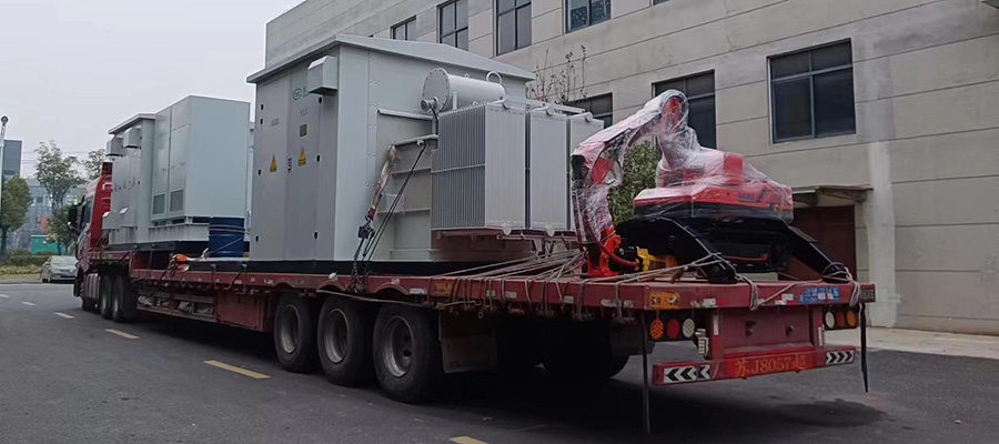 The HCR120C Demolition Robot secured on a truck bed, prepared for overland shipping.