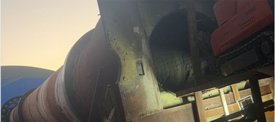 The tracked HCR120D Demolition Robot remotely operated to clear blockages and demolish inside a hazardous rotary kiln environment.